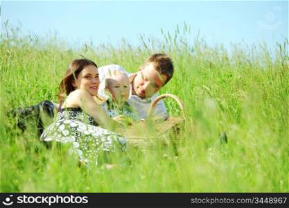 happy family on picnic in green grass
