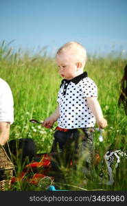 happy family on picnic in green grass