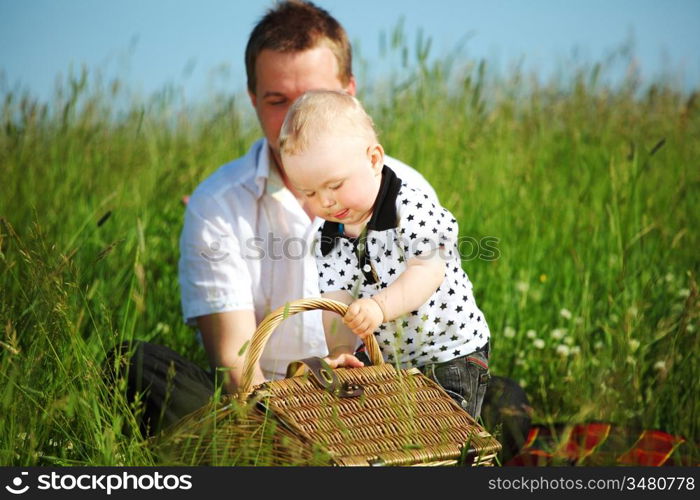 happy family on picnic in green grass