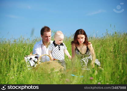 happy family on picnic in green grass