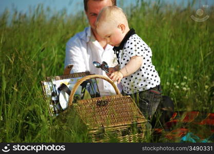 happy family on picnic in green grass