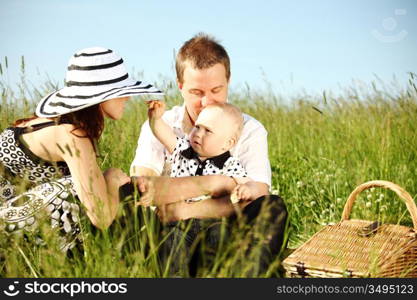 happy family on picnic in green grass