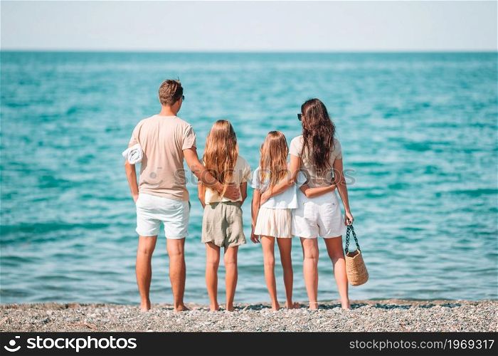 Happy family on the beach on summer vacation. Happy family on the beach during summer vacation