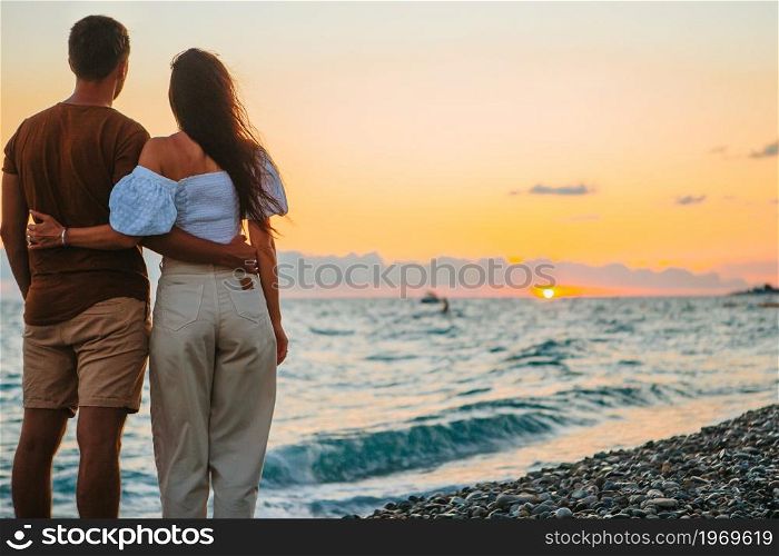 Happy family on the beach vacation. Young couple on white beach during summer vacation.