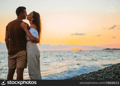 Happy family on the beach vacation. Young couple on white beach during summer vacation.