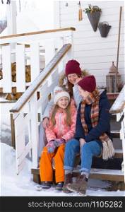 happy family on the porch of the house on the background traditional norwegian wooden house. norway.