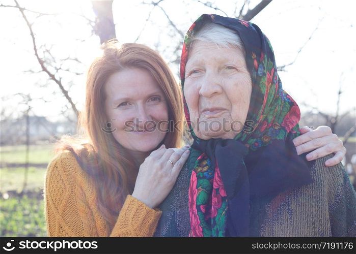 happy family. portrait of smiling senior woman and granddaughter