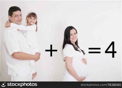 Happy Family: Pregnant mother with father and little girl