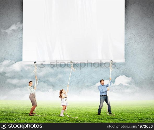 Happy family pulling banner. Happy family pulling banner. Place for text