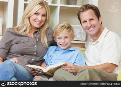 Happy Family Sitting on Sofa Reading A Book