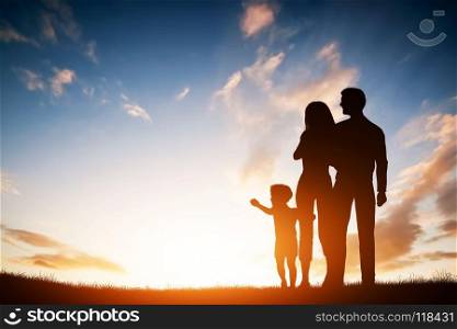 Happy family together, parents with their little child at sunset. Boy reaching the sun. Happy family together, parents with their little child at sunset.