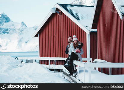 happy family trip to lofoten islands. couple man and girl fun posing for the camera. Norway