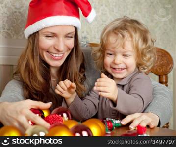 Happy family with Christmas tree decorations