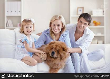 Happy family with dog at home