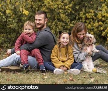 happy family with dog outdoors