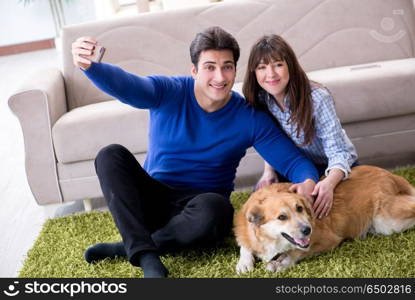 Happy family with golden retriever dog