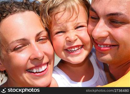 Happy family with little girl, faces