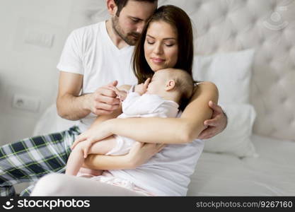 Happy family with newborn baby