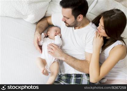 Happy family with newborn baby