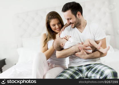 Happy family with newborn baby