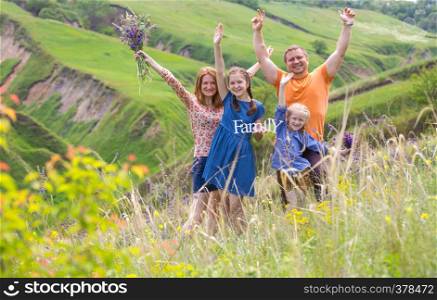 happy family with smiling faces outdoors