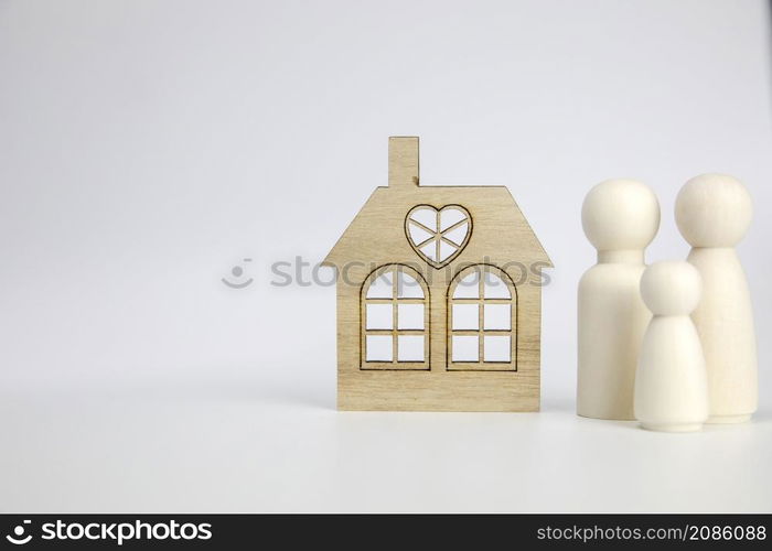 Happy family with there new house. Isolated on white background, wooden object with copy space, real estate, mortgage,property concept space for text. Happy family with there new house. Isolated on white background, wooden object with copy space, real estate, mortgage,property concept