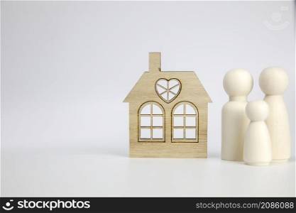 Happy family with there new house. Isolated on white background, wooden object with copy space, real estate, mortgage,property concept space for text. Happy family with there new house. Isolated on white background, wooden object with copy space, real estate, mortgage,property concept