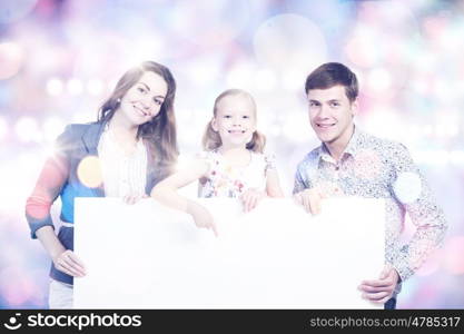 Happy family. Young happy family with white blank banner. Place for text