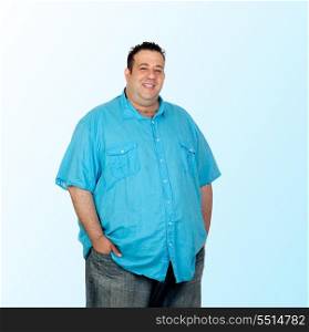 Happy fat man with blue shirt isolated on blue background