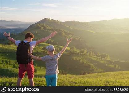 Happy father and son are walking in the Altai mountains. Happy father and son in the Altai mountains