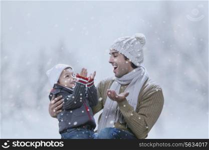 Happy father and son enjoying winter