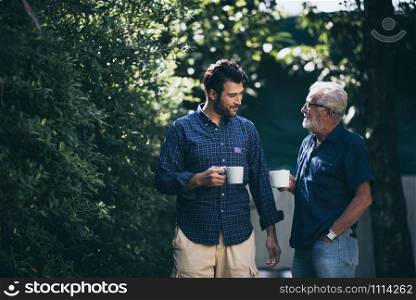 Happy Father and son with coffee cup