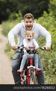 happy father daughter bike