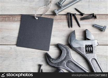 Happy father&rsquo;s day. Greeting card. Old work tools on a gray wooden background.. Happy father&rsquo;s day. Greeting card. Old work tools on a gray wooden background