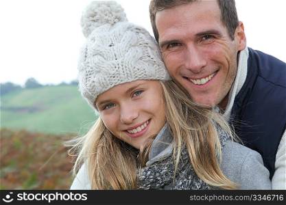 Happy father with daughter in fall season