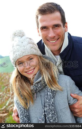 Happy father with daughter in fall season