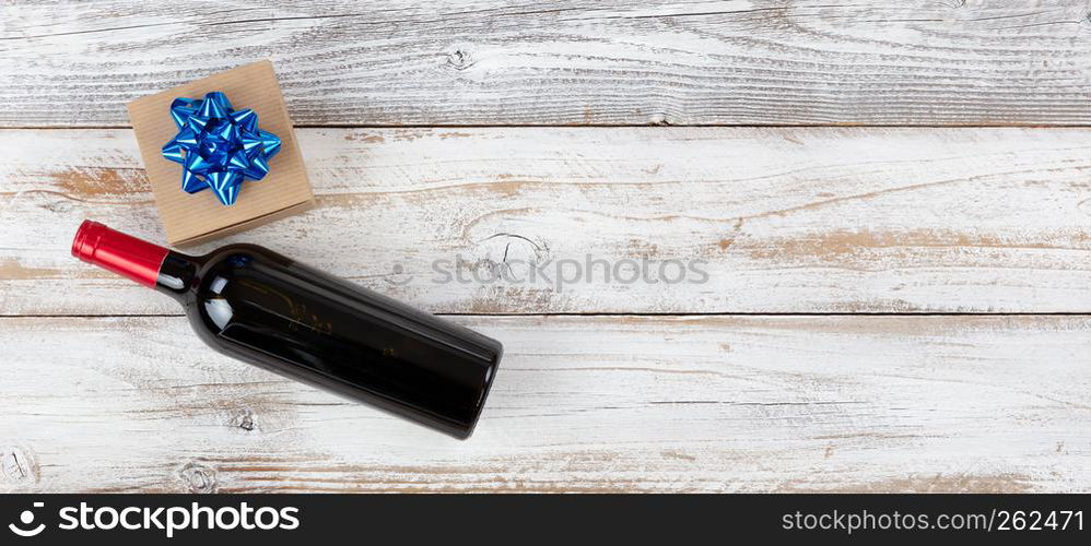 Happy fathers day concept with red wine and dress tie on white wooden background