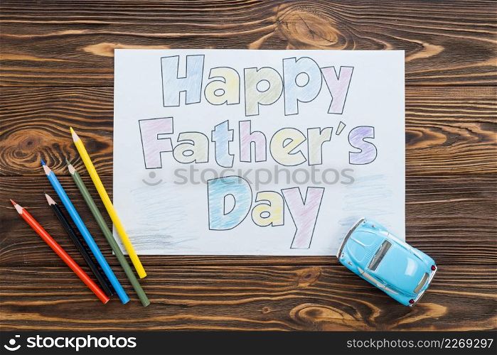 happy fathers day inscription with toy car