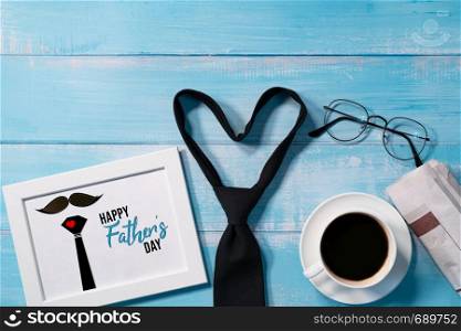 Happy Fathers Day, necktie with a cup of coffee and eyeglasses