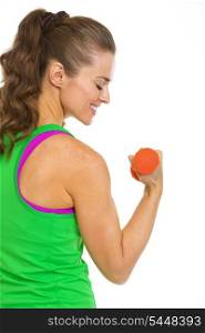 Happy female athlete making exercise with dumbbells