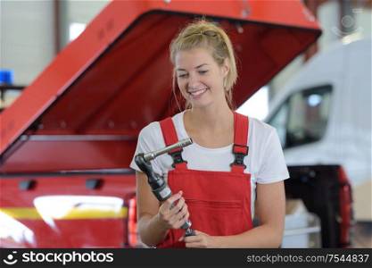 happy female auto repair worker
