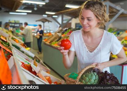 happy female buying fruits in the market