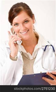 Happy female doctor on the phone with stethoscope