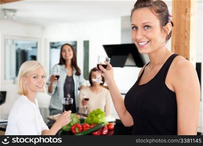 Happy female friends having a casual party at home