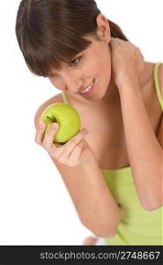 Happy female teenager with green healthy apple
