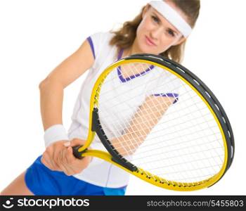 Happy female tennis player in stance