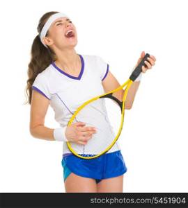 Happy female tennis player playing on racket as on guitar