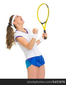 Happy female tennis player with racket rejoicing success