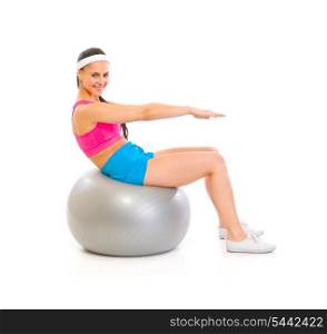 Happy fit female doing abdominal crunch on fitness ball isolated on white&#xA;