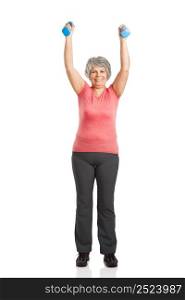 Happy fitness old woman lifting dumbbells and smiling